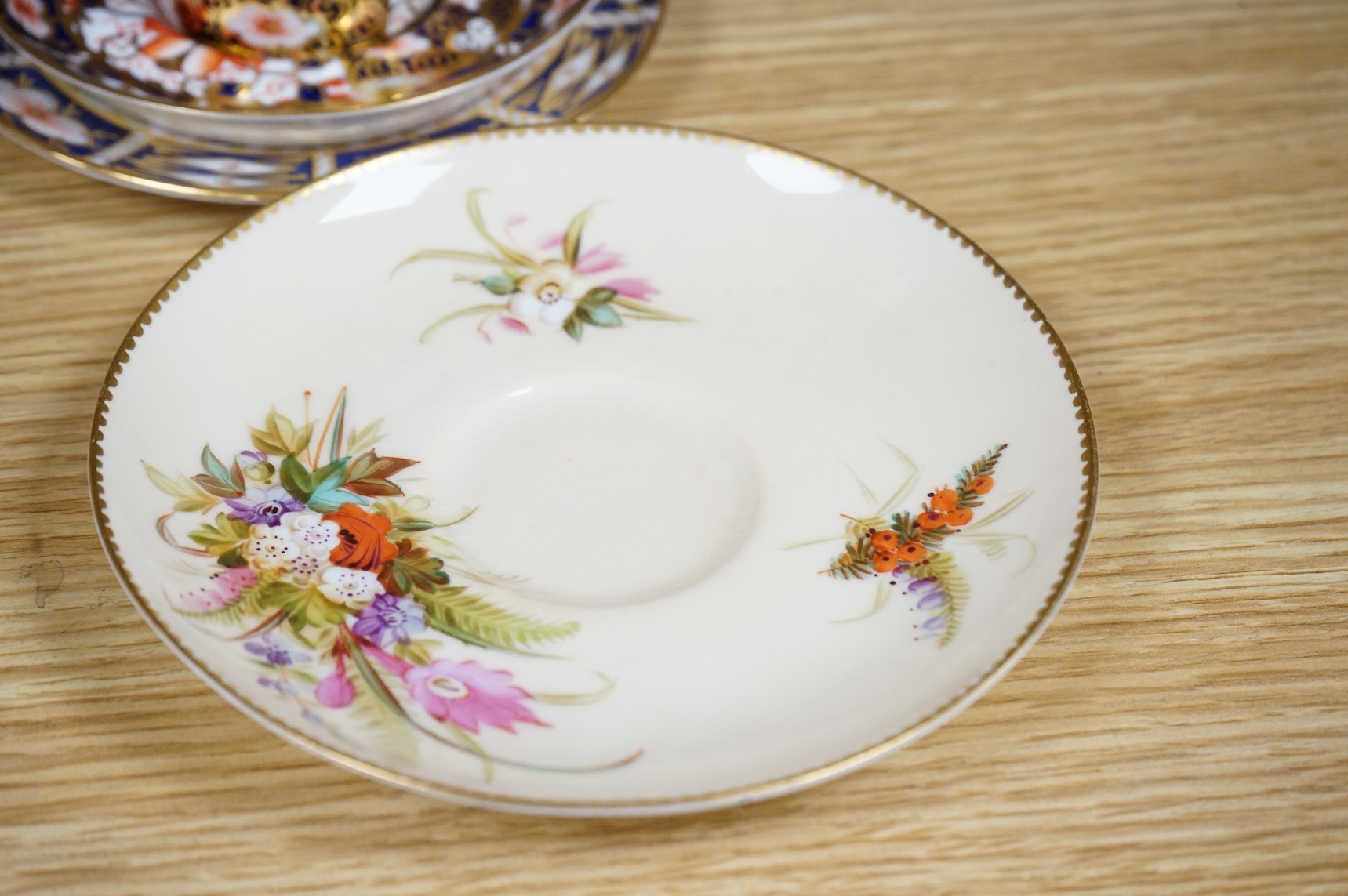 A Worcester butterfly handled cup and saucer and four other items, together with Royal Crown Derby, Dresden and Coalport items. (9). Tallest 13 cm